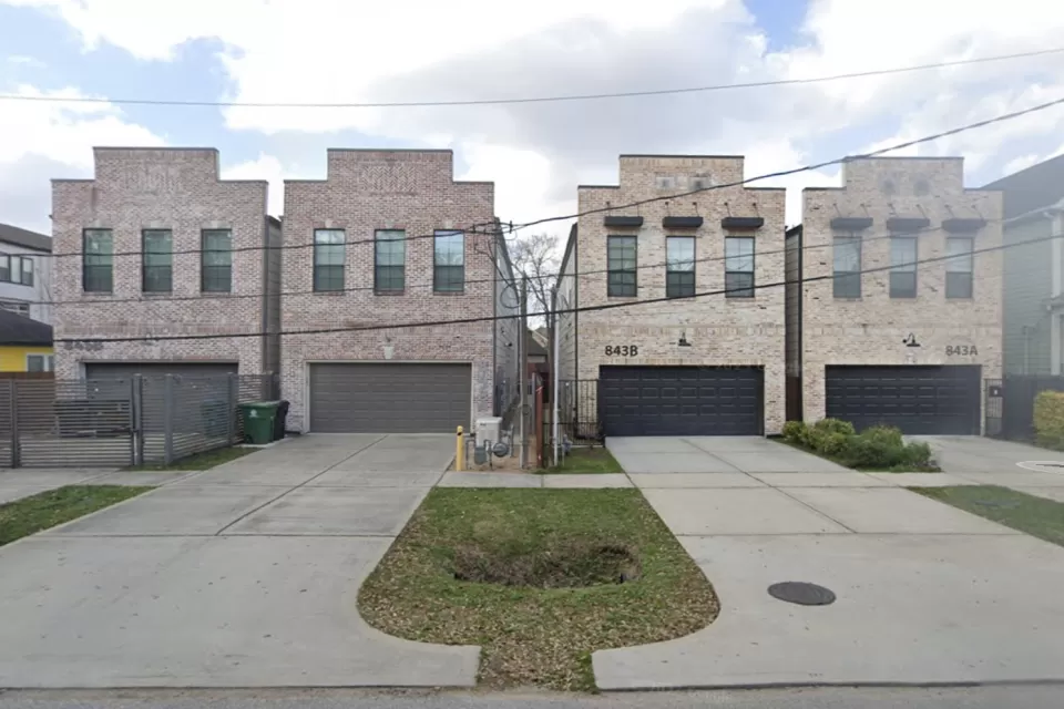 Two-story split lot housing in Houston, Texas with two-car garages
